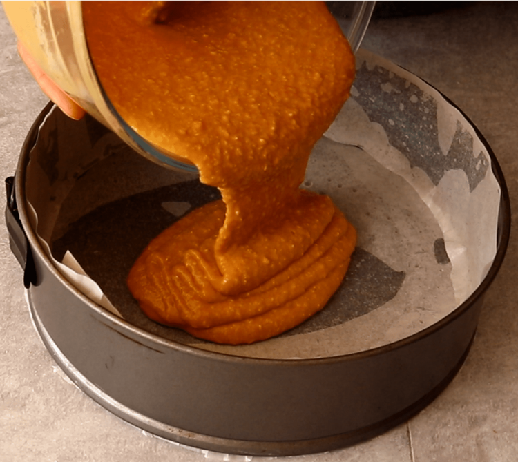 Step 1.1: Pour the batter into the prepared tin and spread it evenly