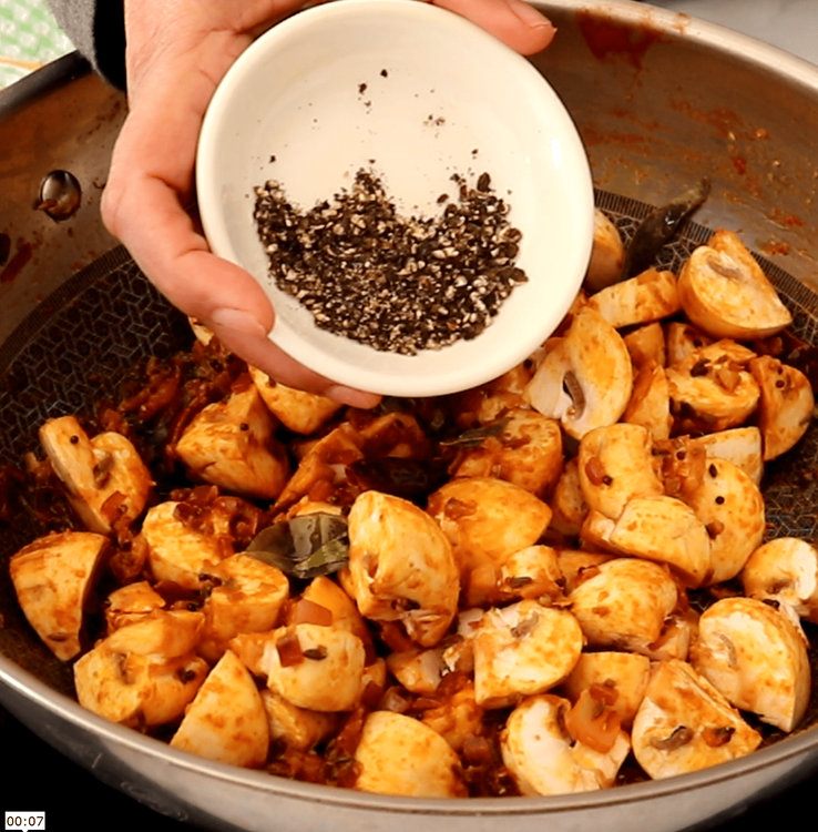 Step 1.2: Add the mushrooms along with coarsely ground black pepper, the remaining curry leaves, lemon juice, and salt