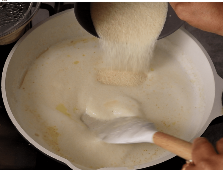Step 2.1: Reduce heat and slowly add semolina, stirring continuously to avoid lumps