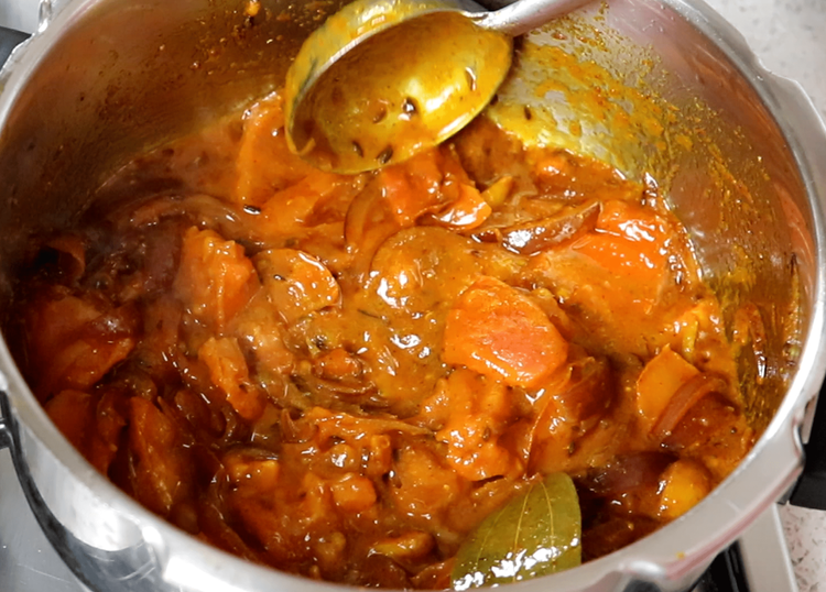 Step 3.2: Add tomatoes and salt, and cook until the tomatoes break down and the oil begins to separate