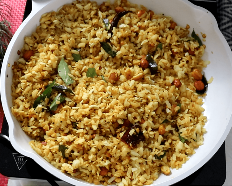 Step 1.1: Add the softened poha to the tamarind mixture, gently stirring to coat the poha evenly