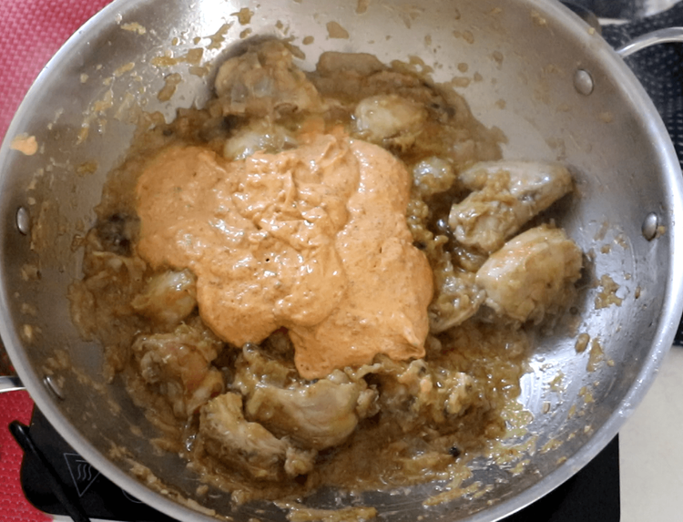 Step 2.1: Pour the prepared curd mixture over the chicken, stirring well to coat each piece
