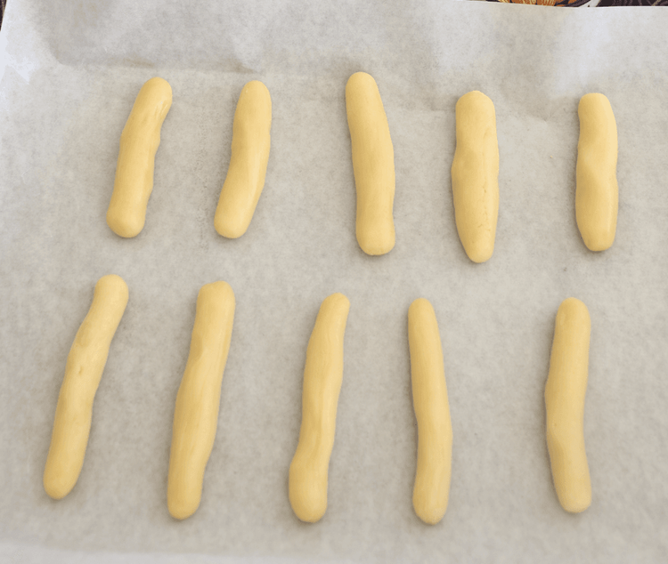 Step 2.1: Take small portions of the chilled dough and roll them into thin, finger-like shapes