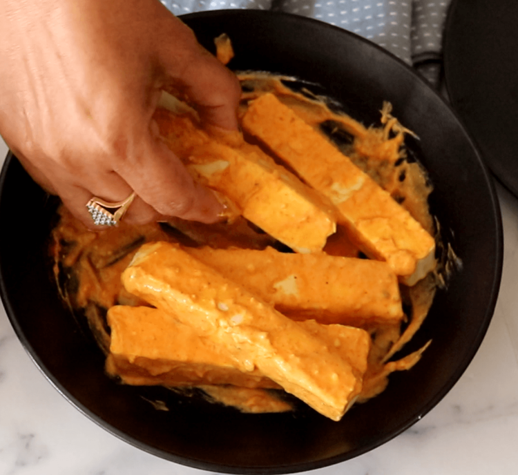 Step 1.2: Add the paneer pieces, ensuring each one is well coated