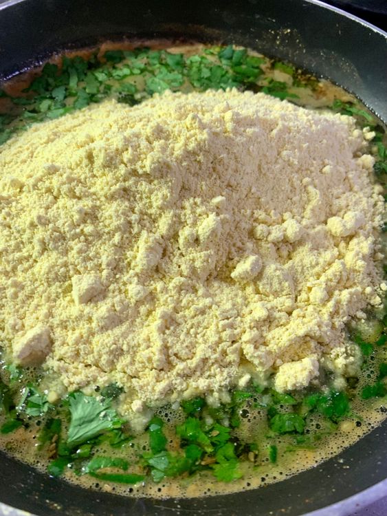 Step 1.1: Immediately add cornmeal flour (Makki atta), and mix well