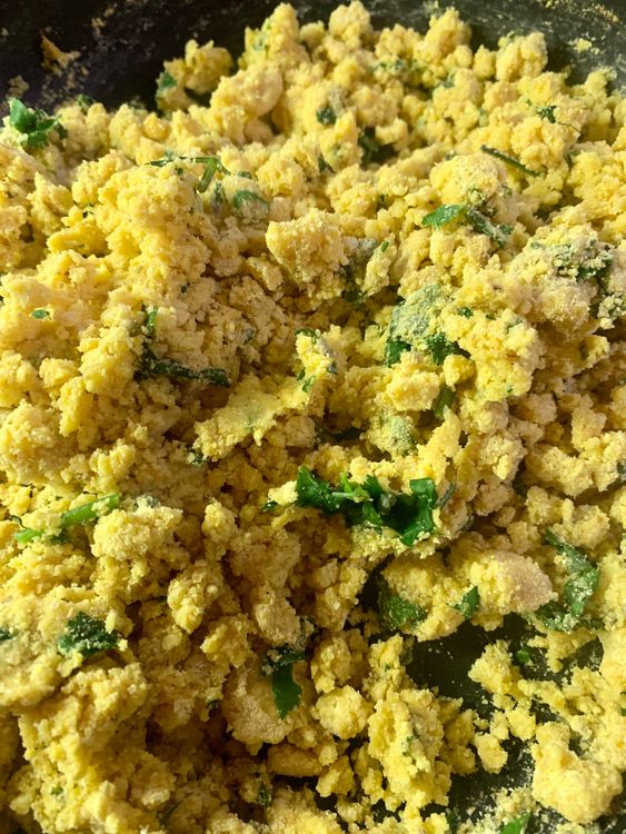 Step 1.2: Immediately add cornmeal flour (Makki atta), and mix well