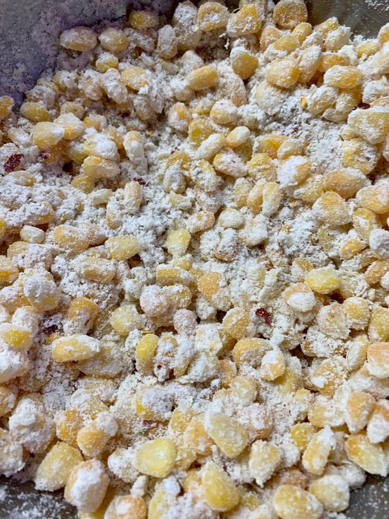 Step 1.2: In a large bowl, mix together corn kernels, all-purpose flour (maida), cornflour, white pepper, chilli flakes, black pepper powder, oregano, salt, and ginger garlic paste, and mix nicely