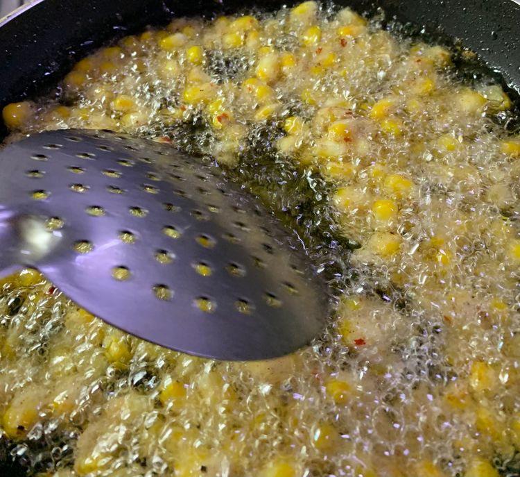 Step 1.1: Stir the corn kernels occasionally to ensure even cooking