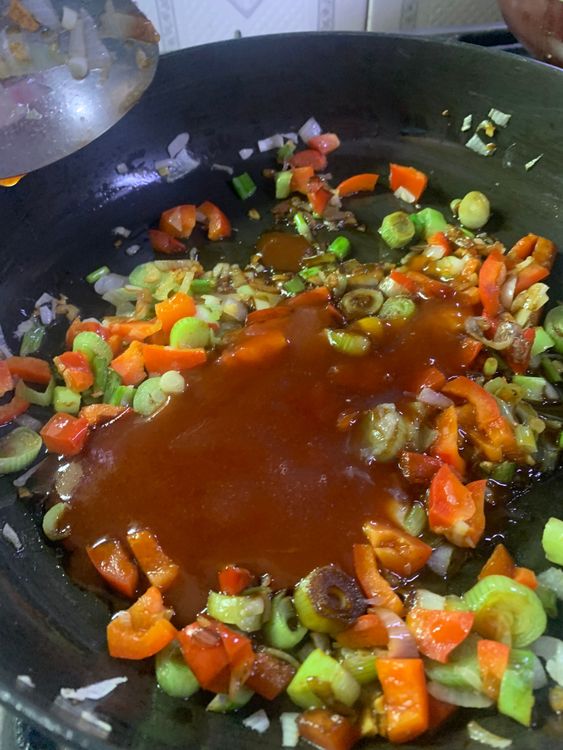 Step 2.1: Add hot and sweet sauce to the pan, along with a squeeze of lemon juice