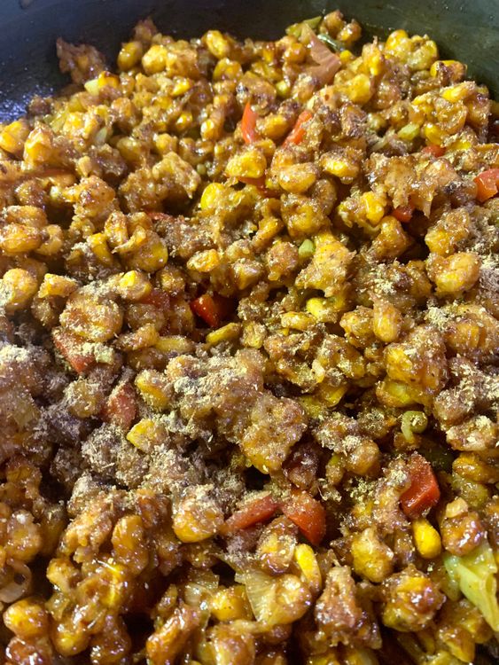 Step 2.1: Season the fried corn kernels with chat masala
