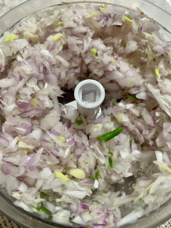 Step 2.1: Chop the onions, tomatoes, and green chilli and place them in a mixing bowl