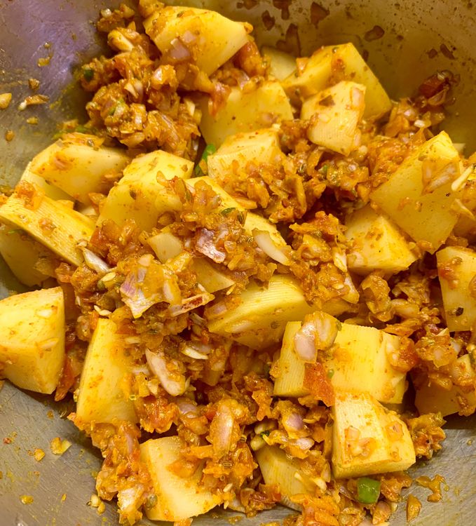 Step 2.1: Mix and combine the cubed potatoes in the leftover mixture and keep aside