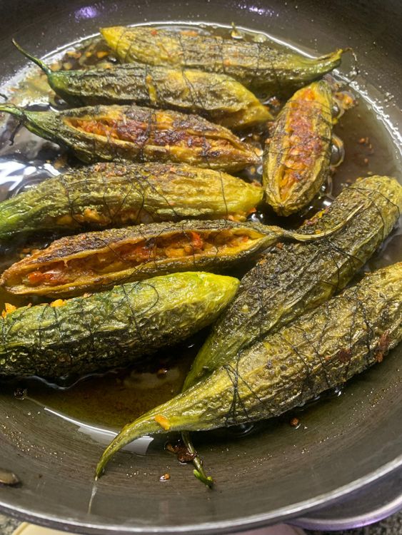Step 3.1: Turn the bitter gourds frequently to ensure that they are cooked evenly from all sides and are golden brown in color