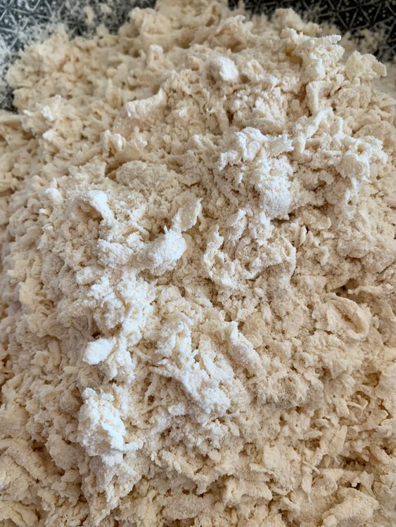 Step 2.2: Add curd and milk to the flour and mix with light hands
