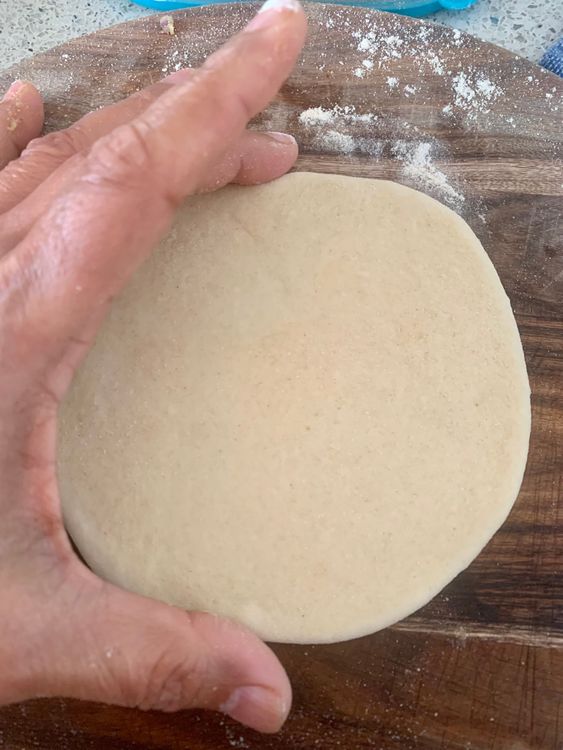 Step 3.1: Roll it with a rolling pin to make a round shape (approx