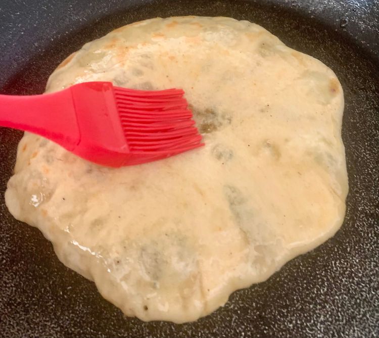 Step 5.1: Brush the naan with little oil on both sides
