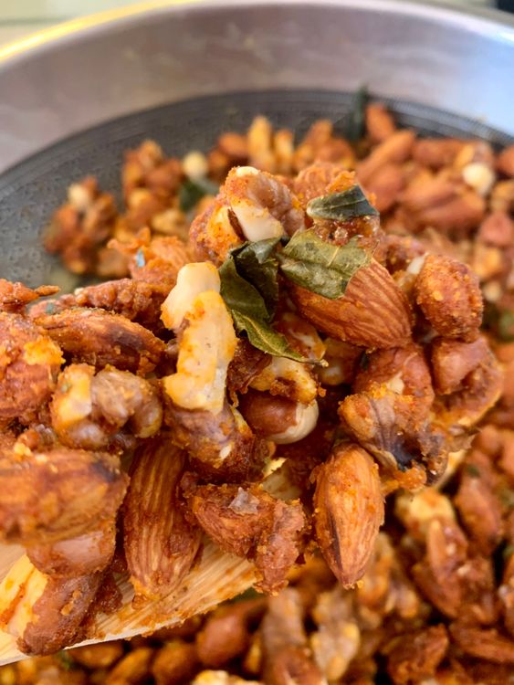Step 1.2: Stir constantly to ensure the jaggery is well coated on the nuts
