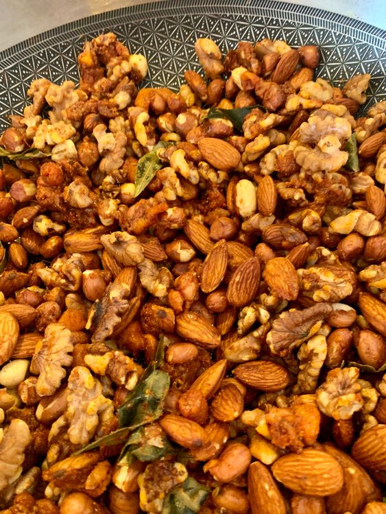 Step 1.1: Stir constantly to ensure the jaggery is well coated on the nuts