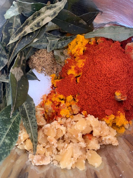 Step 1.1: Mix turmeric powder, kashmiri red chilli powder, garam masala, jaggery, salt, and curry leaves in a large mixing bowl