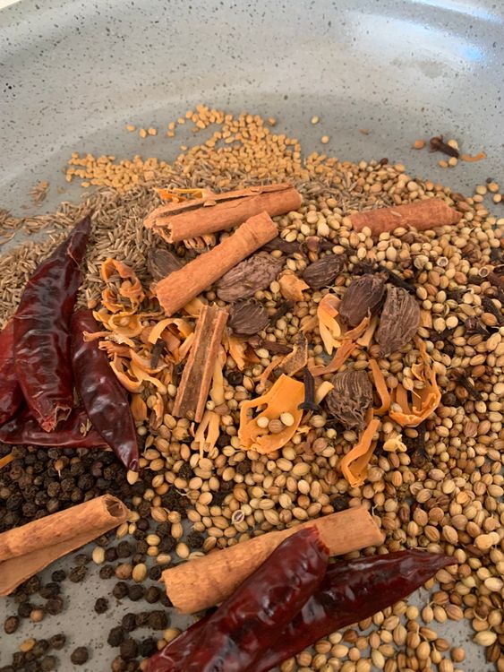 Step 1.1: Add coriander seeds, methrae, cloves, black cardamom, mace, nutmeg, dry red chilli, cinnamon, kasuri methi leaves, black cardamom and cumin seeds