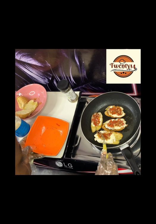 Step 1.5: Get your pan on low heat and brush in with some olive oil, go in with the bread with the buttered part up,then layer with scoops of your tomato mix
