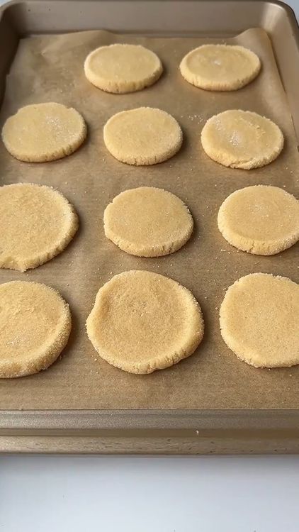 Step 1.1: Dip each ball into sugar and press them flat with a glass