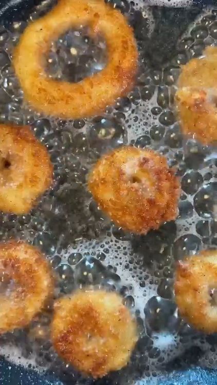 Step 1.2: Carefully drop the calamari into the hot oil in batches, being careful not to overcrowd the fryer