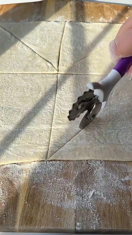 Step 1.2: Cut the puff pastry into squares, then cut each square into triangles