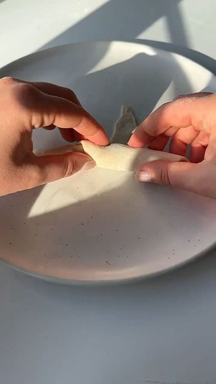 Step 1.2: Add a little bit of Nutella to each triangle and roll them up from the wide end to the tip