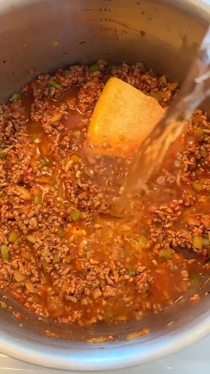Step 1.1: Pour in water and add broken pasta pieces
