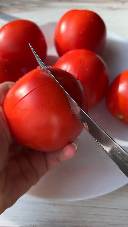Step 1.1: Score the bottom of the tomatoes