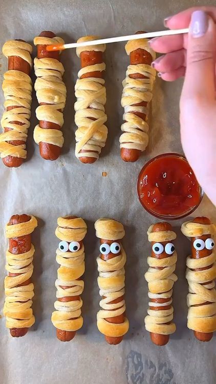 Step 3.1: Let them cool slightly before adding candy eyes using a dab of ketchup to stick them on