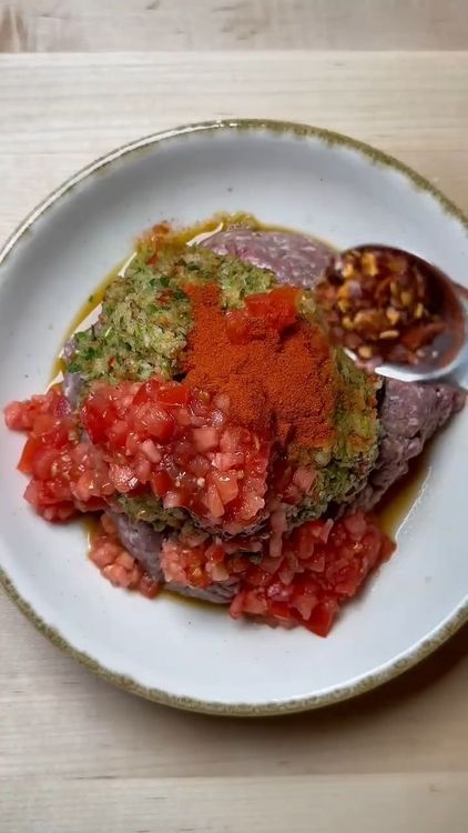 Step 2.1: Add the mixture to ground beef along with tomato paste, red pepper paste, diced tomatoes, paprika, red pepper flakes, black pepper, and salt