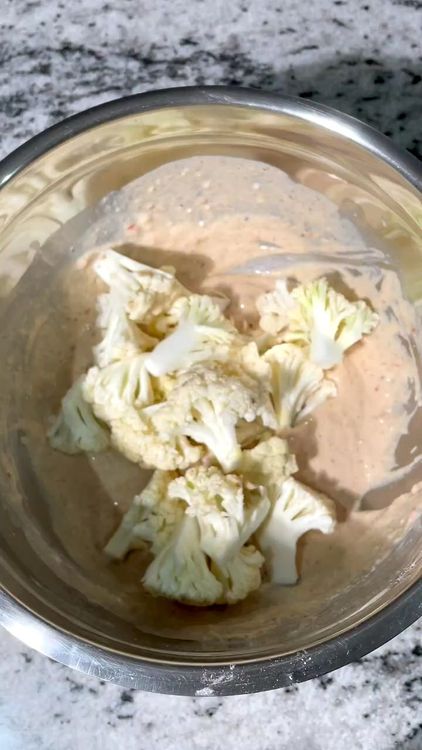 Step 1.1: Dip each cauliflower floret into the batter, then coat it in the breadcrumb mixture