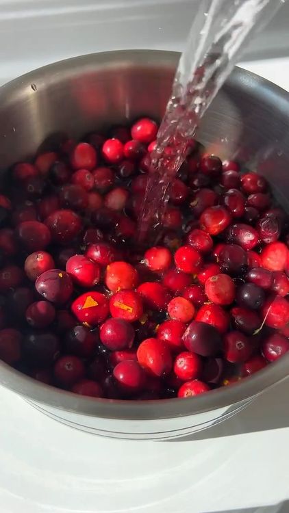 Step 1.2: Combine fresh cranberries, orange juice, maple syrup, and water in a pot