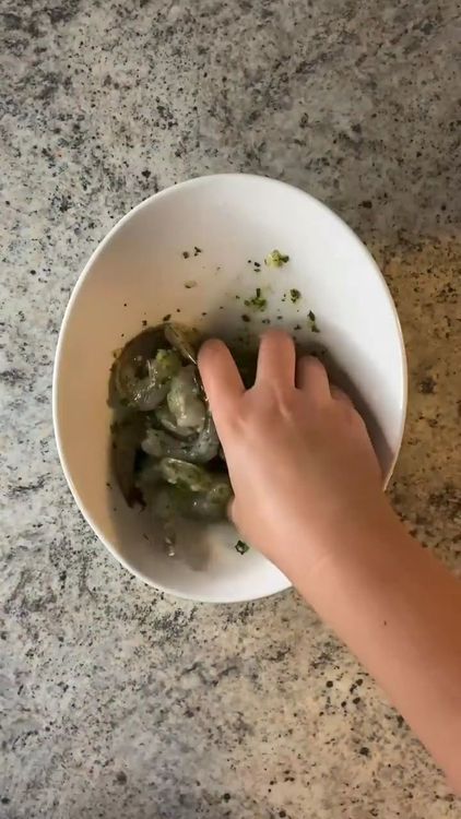 Step 1.1: Add the shrimp to the bowl and coat them well with the mixture