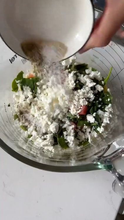 Step 1.2: Mix the tomato flesh with eggs, baby spinach, feta cheese, and spices