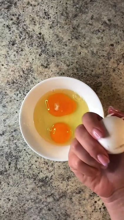 Step 1.1: Crack the eggs into a bowl and add a pinch of salt