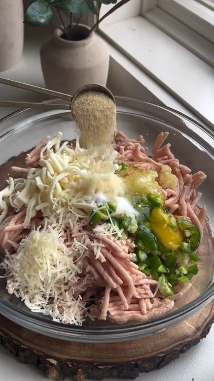 Step 1.1: In a large bowl, combine ground chicken, mozzarella, minced garlic, chopped jalapeno, grated parmesan, eggs, onion powder, and chili flakes