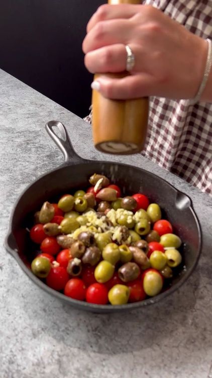 Step 2.1: In a skillet, add the cherry tomatoes, Greek olives, minced garlic, olive oil, and black pepper