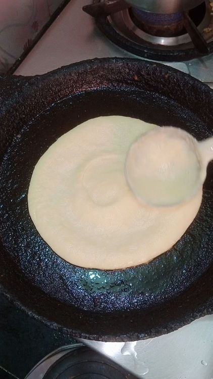 Step 1.1: Heat cast iron tawa on medium flame, splash some drops of water to check temperature