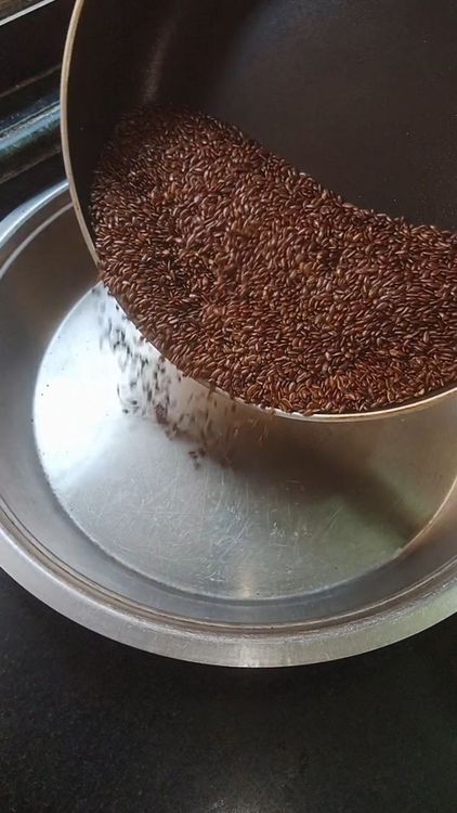 Step 1.3: Heat pan and dry roast 1 cup flaxseeds till the seeds starts fluttering