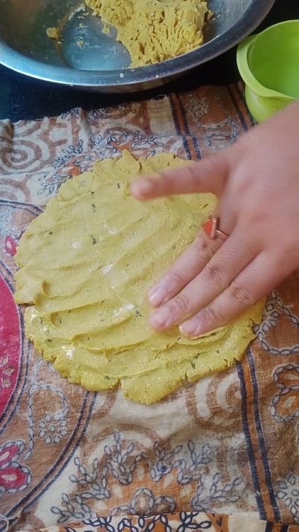 Step 1.1: Take a small portion of the dough and roll it into a ball