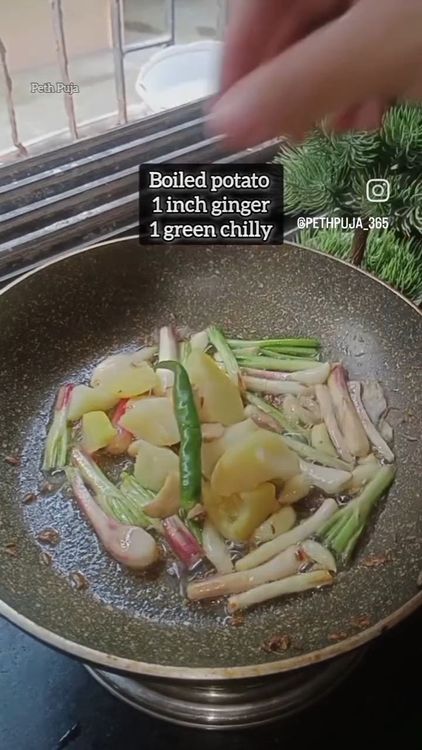 Step 1.2: In a pan , heat butter and once the butter melts , toss cumin seeds, spring onion and garlic pods