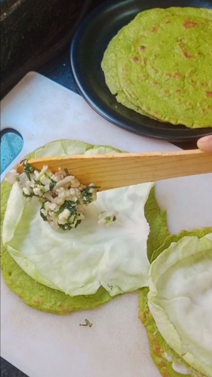 Step 3.2: Take palak wrap , apply soaked cashew paneer paste, place cabbage leaf, add the palak paneer stuffing, any salad pickle like salted onion or capsicum