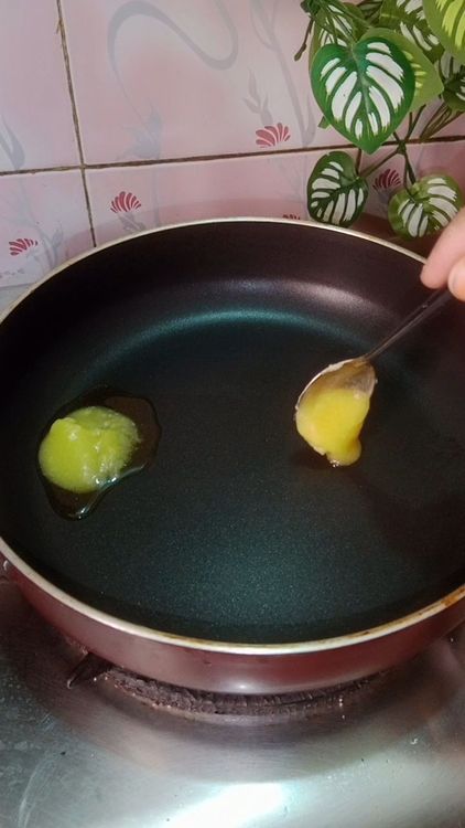 Step 1.1: Heat ghee in a deep bottom pan , add the steamed amla paste , cook till the mixture loses it's moisture