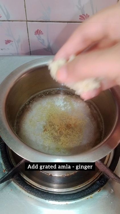 Step 1.2: Heat 1 cup water in a utensil, once water starts boiling add grated ginger and amla