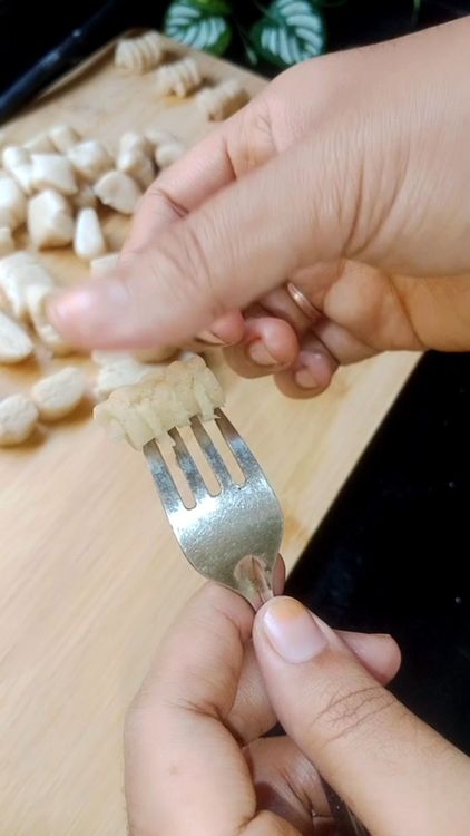 Step 1.1: Flatten the ball on the back of a fork or a clean comb