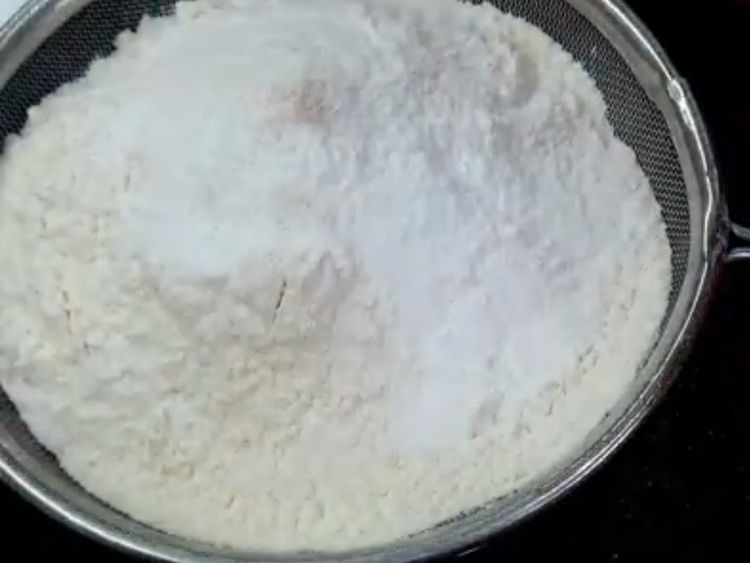 Step 1.1: Now, Take your all purpose flour , Baking powder and Baking Soda and Strain it into the mixture and mix it till there are no lumps 
