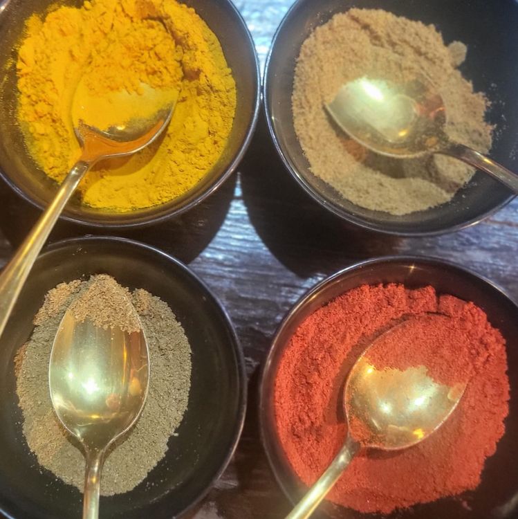 Step 1.1: Add the curry leaves, garam masala, cumin powder, turmeric, and chilli powder